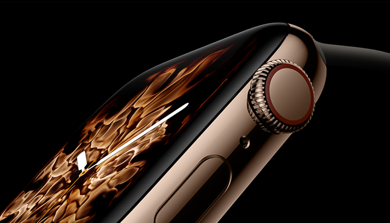 The gold stainless steel Apple Watch Series 4, displaying the new Fire watch face.
