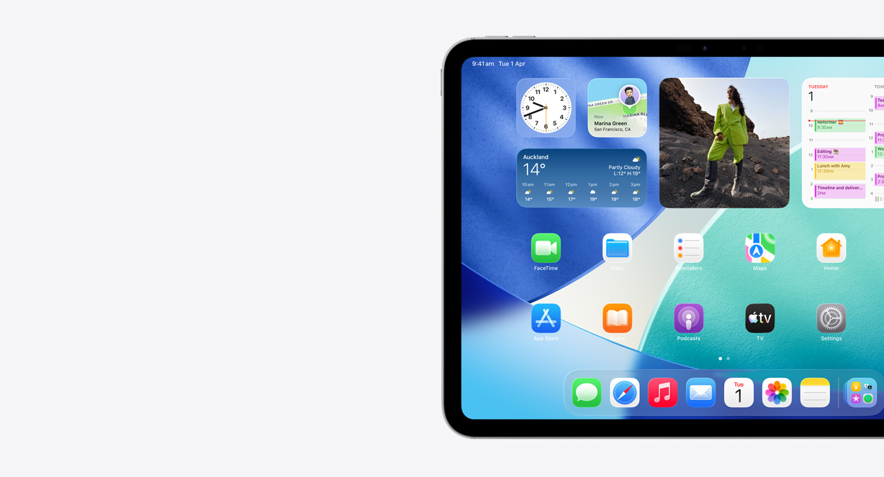 iPad, landscape orientation, left side of screen only, Home Screen with stacked widgets including translucent clock showing Liquid Glass effect, Find My app, Weather widget, two rows of smaller apps and the dock